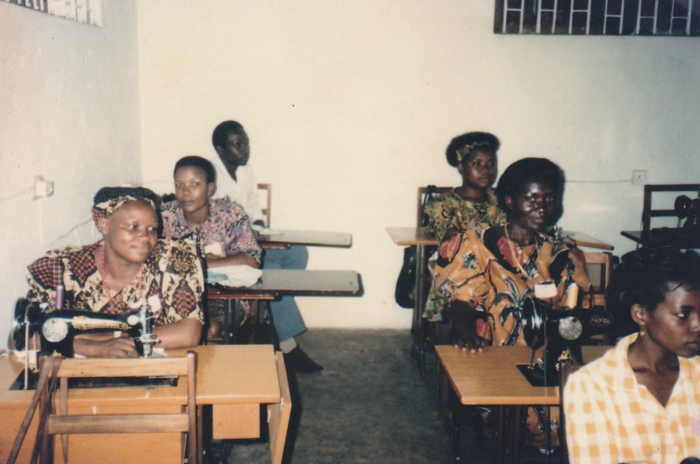 A tailoring session at treadle sewing machines.